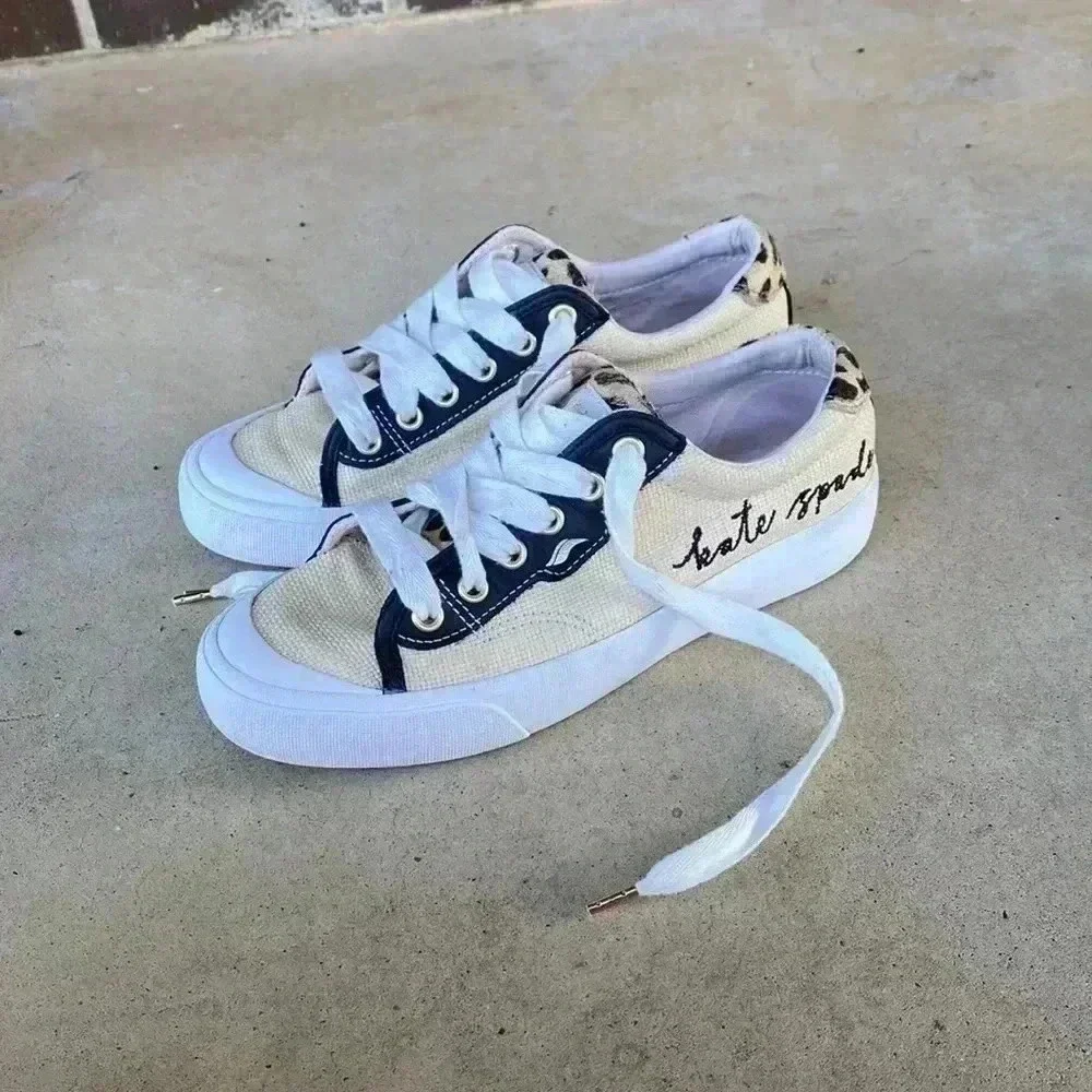 Keds beige canvas sneakers with black trim and leopard heel